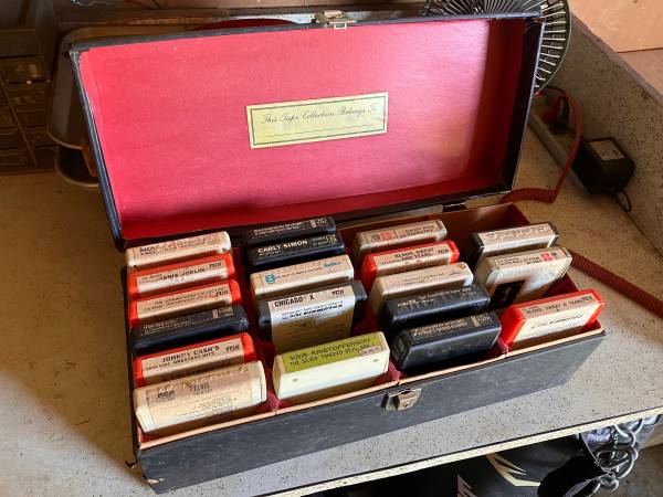 A box of old records is shown with some tapes.