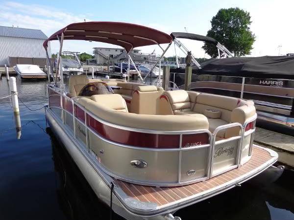 A boat with two seats and a canopy on the front.