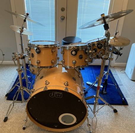 A drum set is sitting in front of the door.