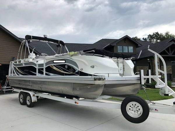 A boat is being loaded on the trailer.