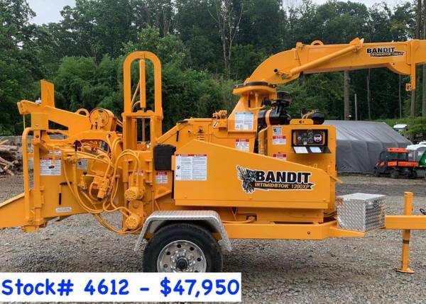 A yellow bandit tree chipper on trailer.