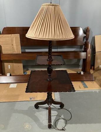 A lamp that is on top of a table.