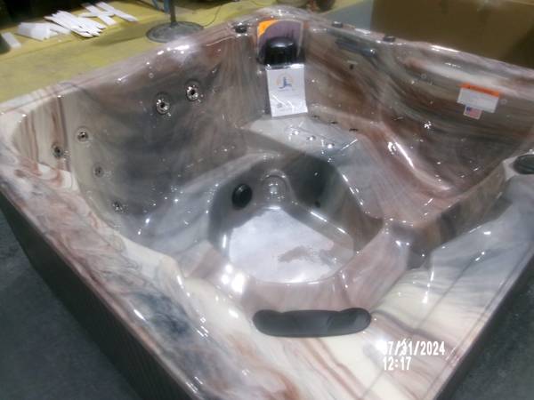 A large marble sink sitting on top of a table.
