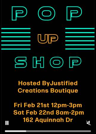 A neon sign that says pop up shop.