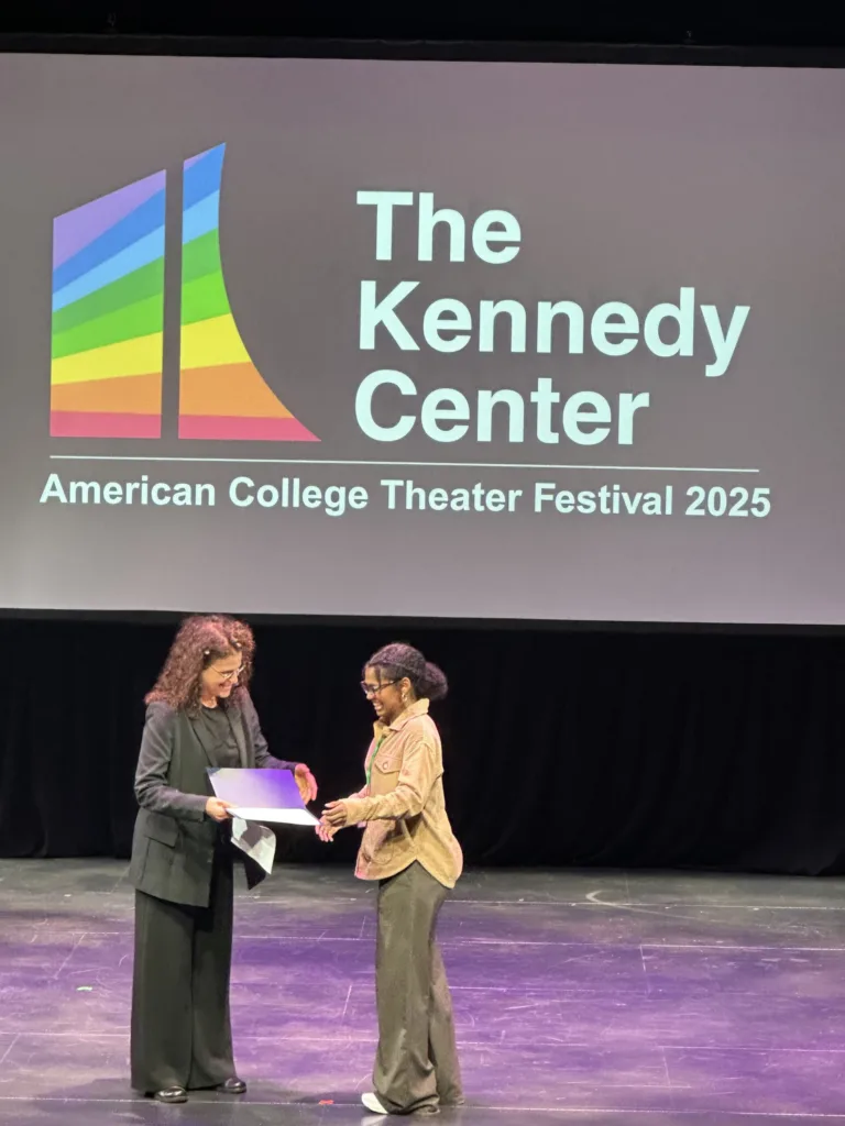 Gabby Burton (right) receives the Voice and Speech Trainers Association Excellence Award at the Kennedy Center.