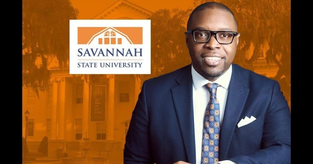 Man in suit with Savannah State University logo.