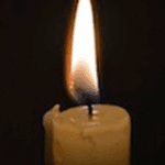 Lit candle with a bright flame.
