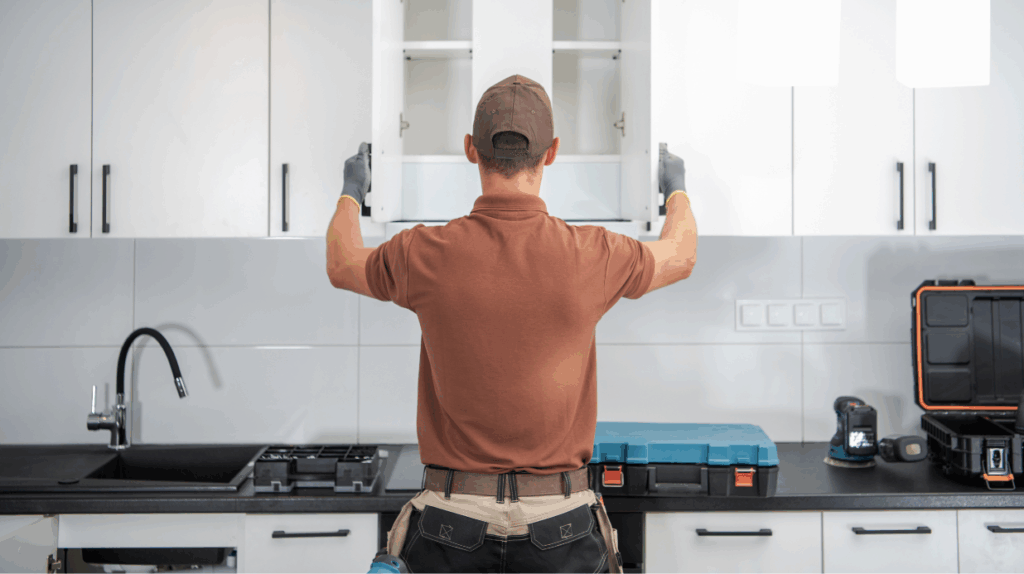 Kitchen Modifications for Seniors to Remain Safe at Home Contractor renovating kitchen cabinets